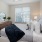 Bedroom with natural lighting and high ceilings