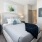 Bedroom with natural lighting and high ceilings
