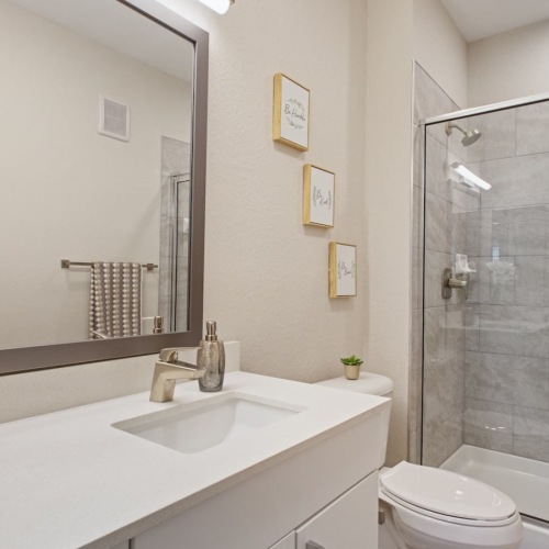Quartz Countertops bathroom with modern finishes and ample counter-space