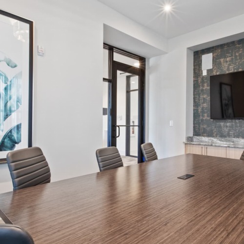 Conference Room conference room with a large, wooden table and modern decor