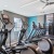 fitness center showing plenty of cardio equipment and modern decor in a large, spacious room