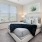 Bedroom with natural lighting and high ceilings